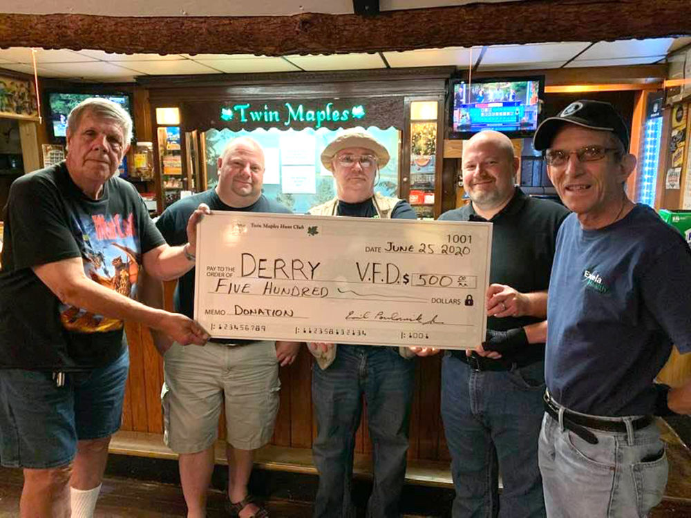 Twin Maples Hunt Club presents check to Derry VFC